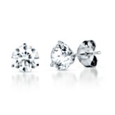 Crafted from 14K white gold, these beautiful stud earrings feature two shimmering round diamonds weighing approximately 1 1/2 ct. tw.  I-J color, I2 clarity