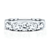 14K white gold band with 5 round brilliant cut diamonds weighing approximately 1 1/2 ct. tw.