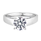 14K white gold solitaire engagement ring with 1 round brilliant cut diamond weighing approximately 1 1/2 ct. tw.